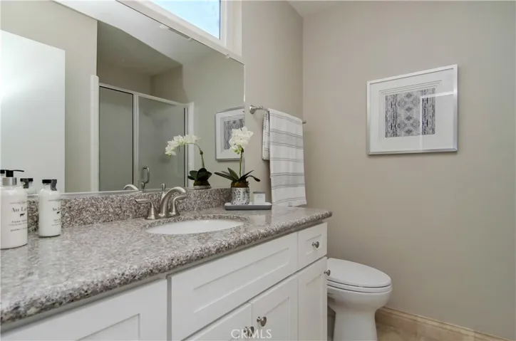 Master Bath: long counter top and shelves for plenty of storage