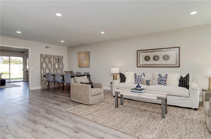 Vinyl plank flooring spans throughout the entire home