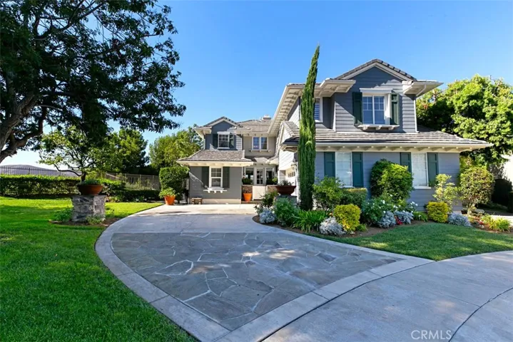 Front of house next to culdesac with walking path to parks, sports fields and award winning Bernice Ayer and Truman Benedict schools.