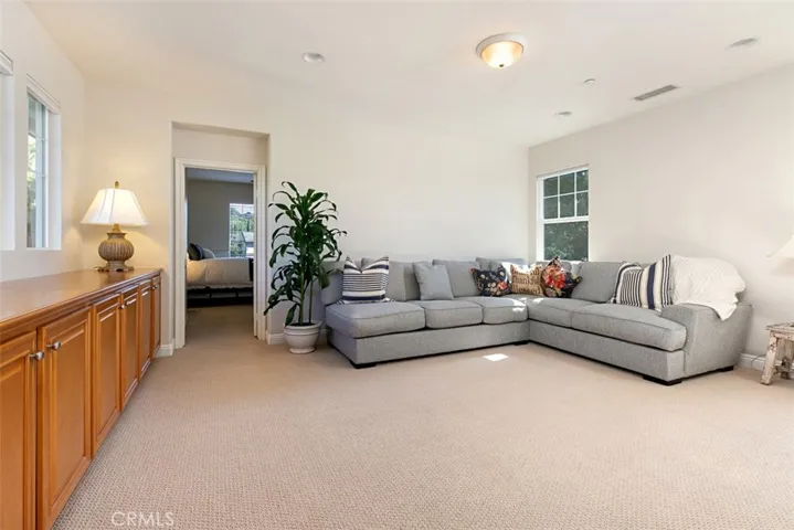 Loft leads to bedroom with full bath