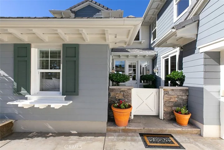 Your darling courtyard entry off the driveway