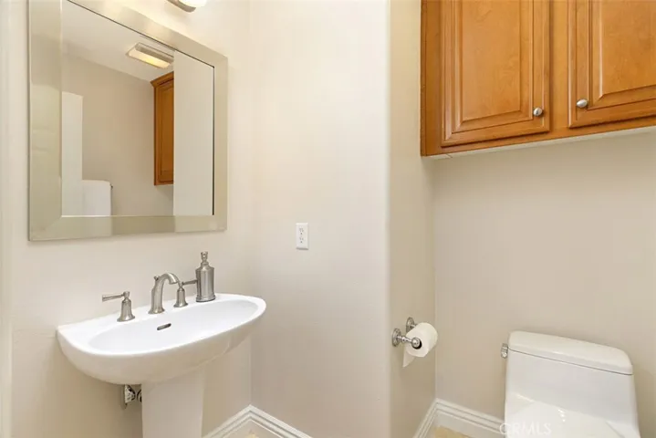 Guest Powder Room located off the Front Foyer