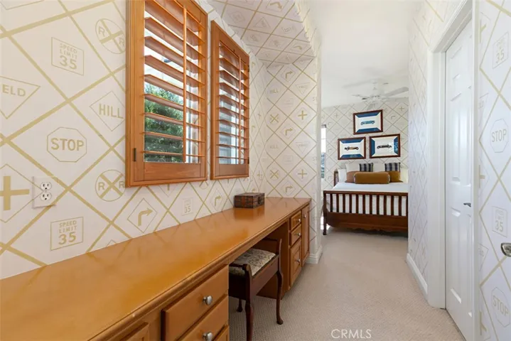 Another Upstairs Bedroom with built-in counter and desk area.  En-suite Bathroom