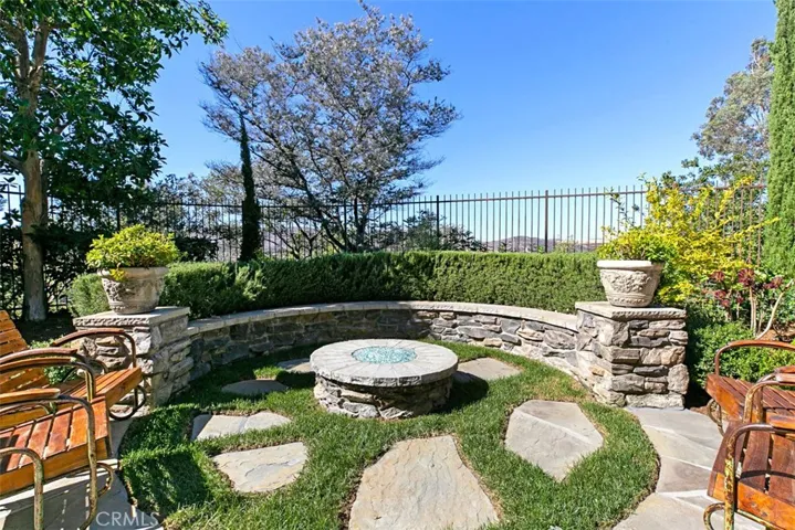 Firepit area of backyard surrounded by your Fragrant English Garden