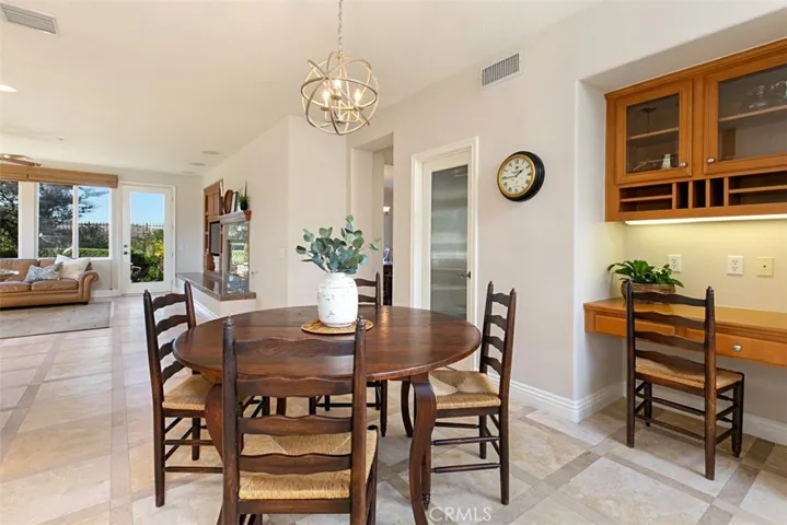 Enough room in the expansive Kitchen for a Glass Door Pantry and functional Kitchen work Station/Desk