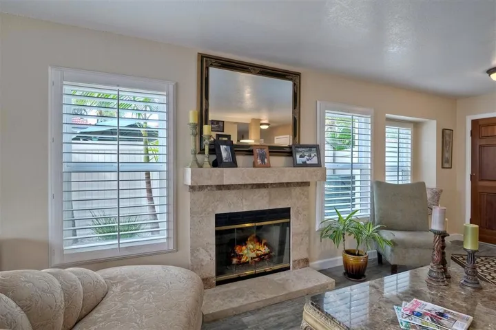 Beautiful living room with new flooring and gorgeous fireplace.