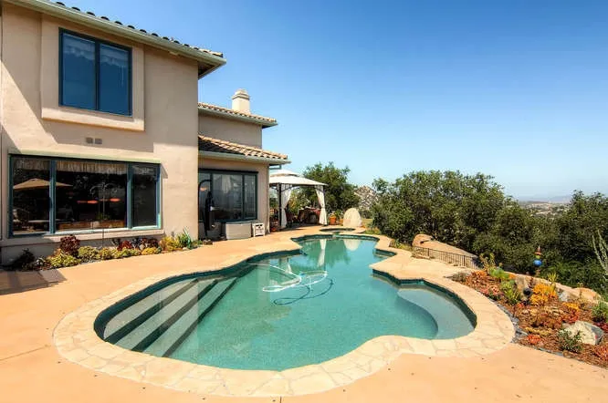 Large backyard for gatherings.  There is a pool net for safety when needed.  Owner knows that it works well when she fell on it once!  :))  Enjoy the view of the oak trees.