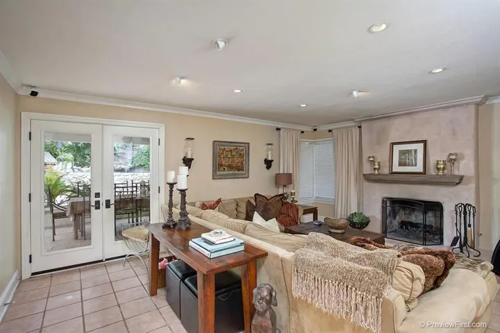 Comfortably elegant FR with Surround Sound and Double Doors to Covered Patio.