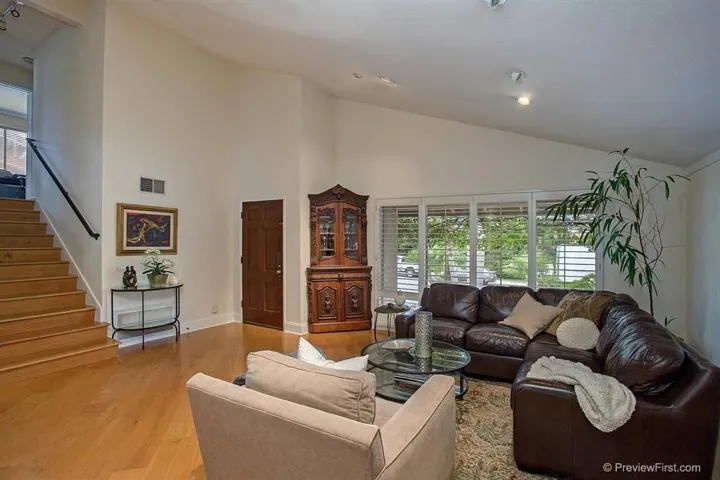 Wide Plank Oak Flooring, Plantation Shutters, and Vaulted Ceilings
