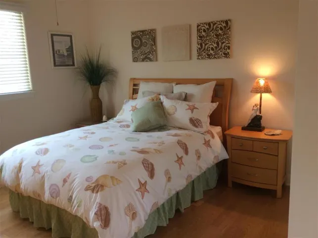 The second bedroom has wonderful vaulted ceilings and an ensuite bathroom.