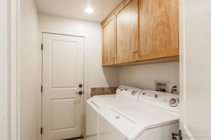 The laundry room has great cupboard space!!