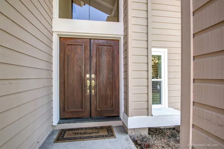 Double Doors greet you at the Vaulted Entry