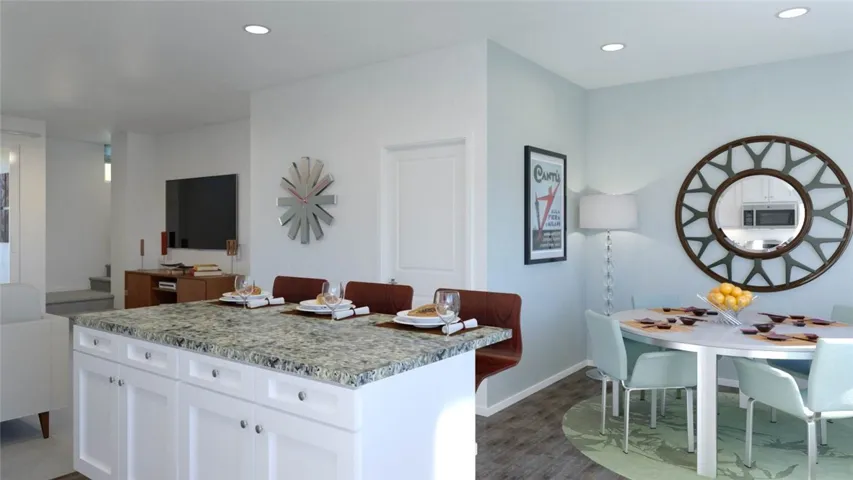Plenty of seating available at the generously sized kitchen island and adjoining private dining space.