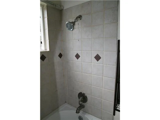 Gorgeous remodeled bathroom, spacious tub with beautiful tile design.