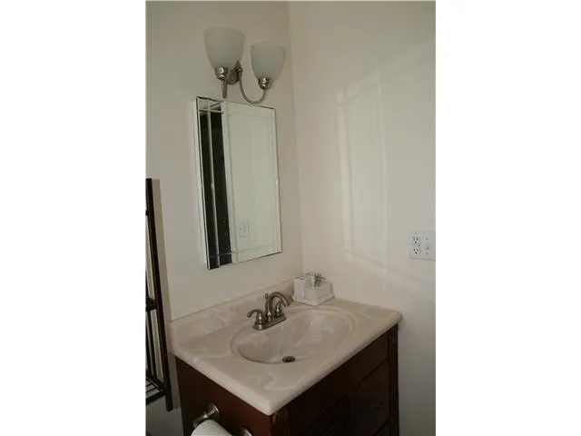 Marble sink, custom vanity, new lighting and fixtures.