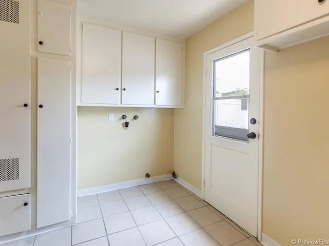 Inside Laundry with Door open to side garden from kichen