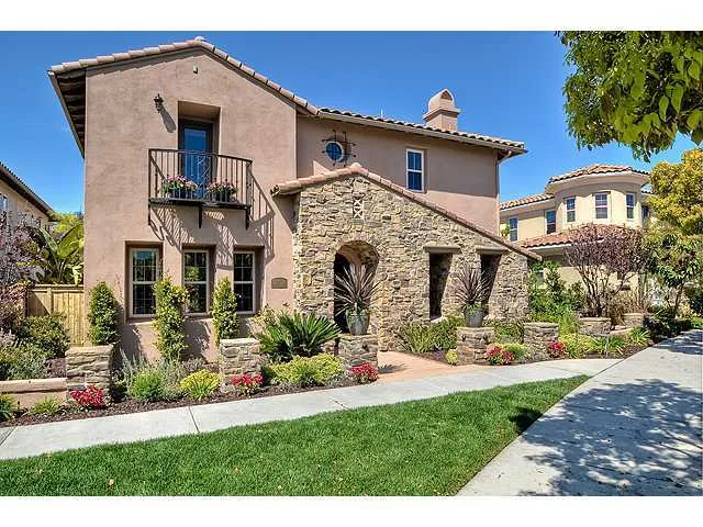 As you approach the front door, you are greeted by its beautiful Tuscan-inspired architecture & lush landscaping.