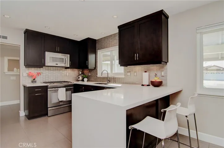 Any chef will love this kitchen...helpers can keep the cook company at the bar...good homework space too...