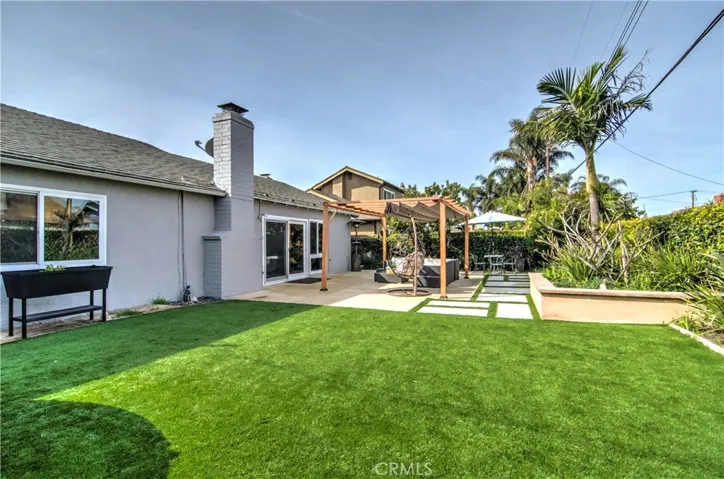 Huge, pool size rear yard...EZ maintenance too with water wise artifical turf and thoughtful planter areas...