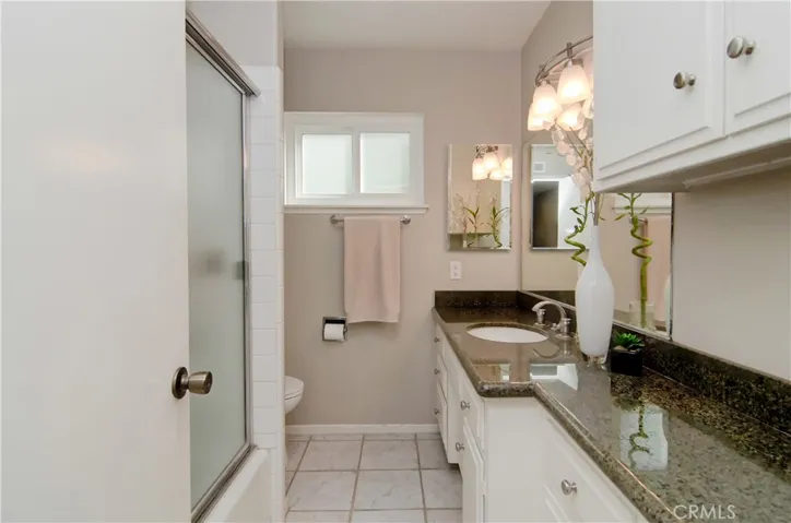 Sparkling hall bath has loads of storage and more nice details...