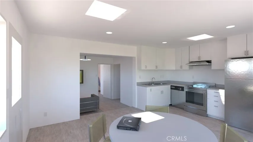 Open kitchen/living area, tons of natural light and plenty of space for fully furnished living room in this spacious room