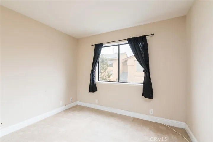 Bedroom #3 which faces the front of the property overlooking greenbelt.