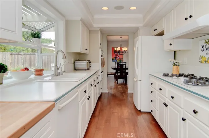 This kitchen is definitely the hub of the home with plenty of cabinet and prep space, plus the cook enjoys beautiful garden window views of the private back yard.