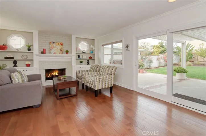 Separate family room is the perfect hang out with fireplace, plus huge slider makes for easy transition to the outside for entertaining.