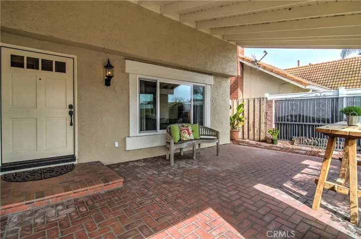 Dramatic, covered entry is a cool place to hang out, and could be an awesome California outdoor room...just add a fireplace...