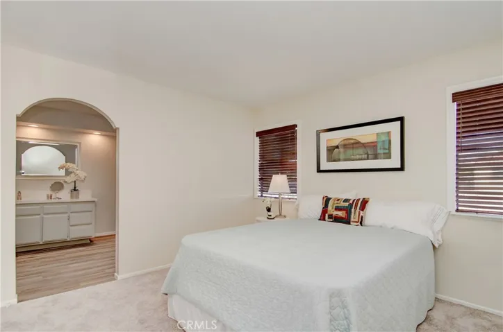 Spacious master suite has roomy bedroom and two separate wardrobe closets.
