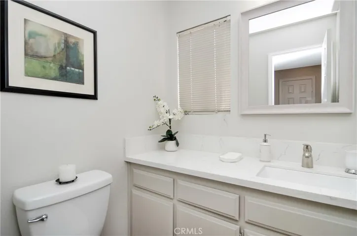 Plenty of extra storage in this downstairs bath...new fixtures, sink and quartz counters.