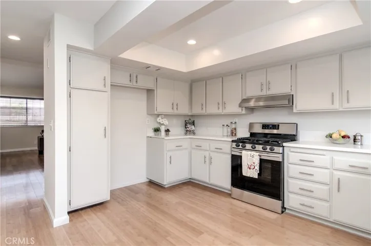 Beautiful, updated kitchen has loads of storage and prep space.