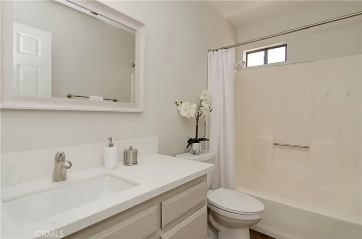 Hall bath has new fixtures, plank flooring and quartz counters.