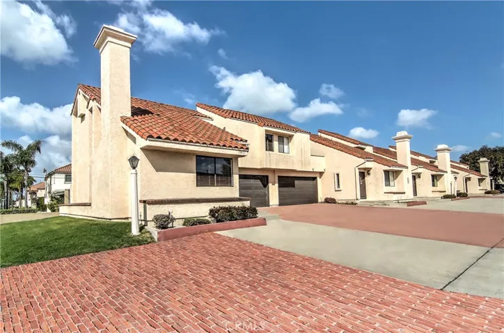 End unit location with only one common wall.  Two car garage plus driveway parking for two additional cars.