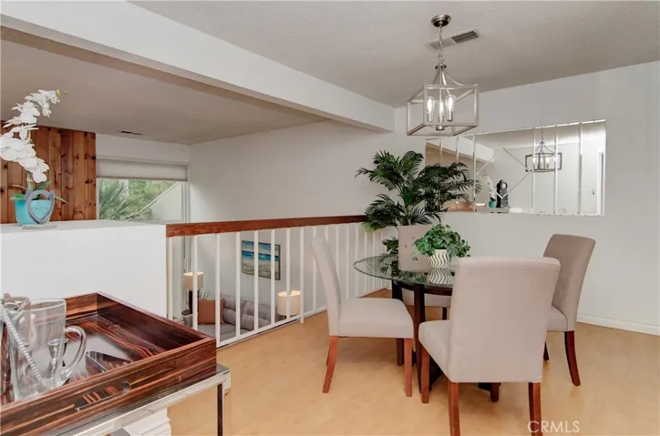 Formal dining area with floor to ceiling mirrors and easy access to the kitchen