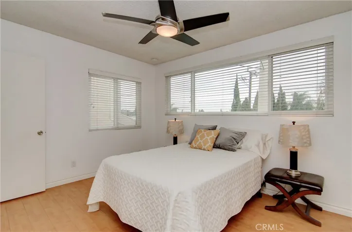 2nd Bedroom with ceiling fan, private location, wood flooring and large enough to be utilized as anything: Guest room, office, play room, home gym, nursery, kid's room...you get the idea!