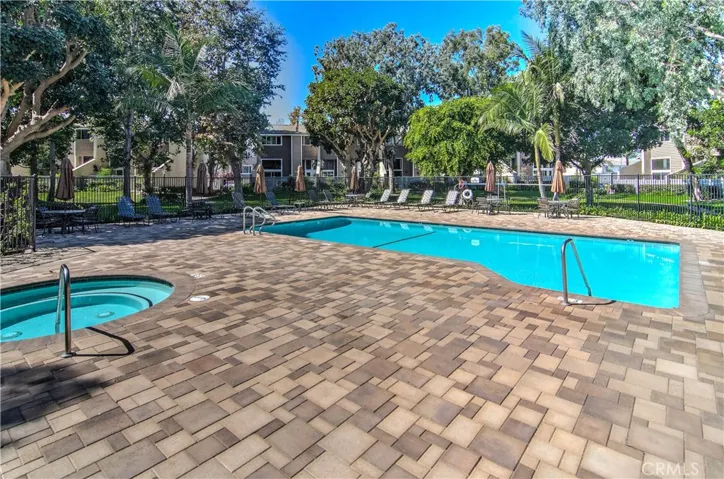 Vacation at home? Look at the landscape, the well-maintained pool and spa, the hardscape...the only thing missing are the sounds of the steel drums!