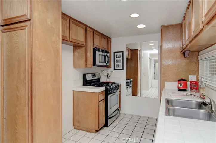 PLENTY of storage in this kitchen: walls to wall cabinetry!