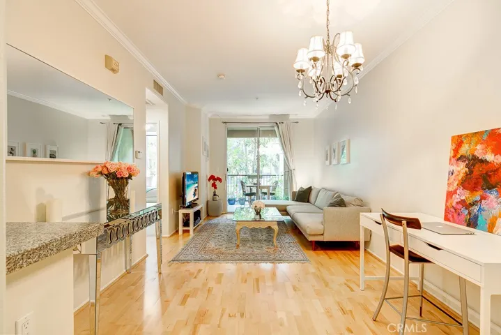 Grandfathered in HARDWOOD floors!!! Open Concept, granite counters, breakfast bar, spacious bedroom and bathroom, crown molding, and so much more!