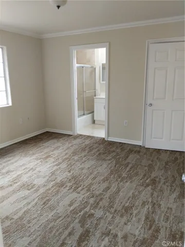 Spacious MASTER BEDROOM is private and note the custom base and crown moldings. BATH boaasts newer vanity and tub/shower combo!