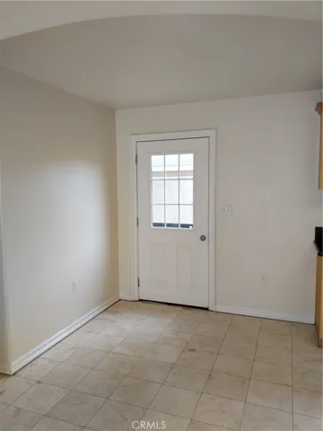 Informal DINING AREA has direct access to  rear yard area, and to the garage!