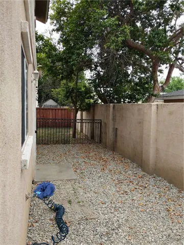 Easy care yard, is fenced.. and your graasy common area is just beyond, which extend the play and party options!