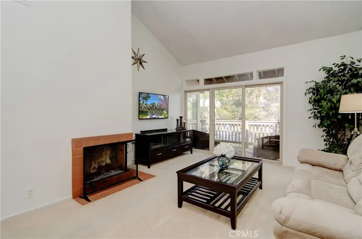 This light and bright unit has it all! Open floor plan, high vaulted ceilings, fireplace and huge slider to private balcony.