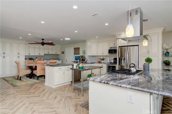PLENTY OF STORAGE! New cabinetry with soft-close hardware all along the perimeter.