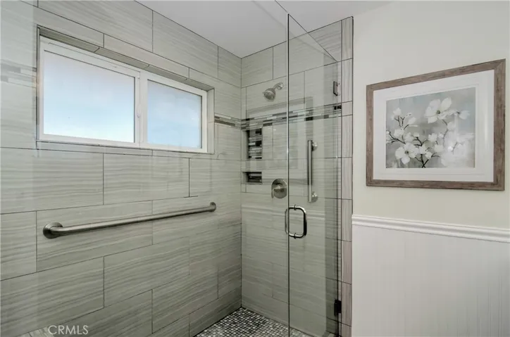 Spread your arms out... this shower has been extended and it's beyond comfortably wide.