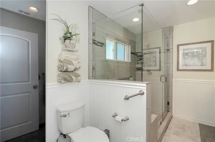 This master bath has been updated including removing the corner of a sharp wall which makes it feel so much more spacious.
