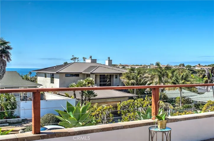 Lounge on your back balcony. It's the width of the entire home!