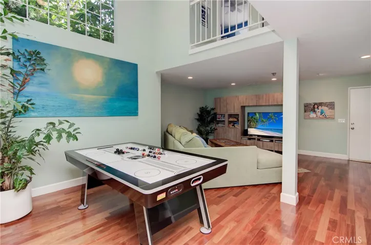 Two story ceiling and clerestory windows add wonderful detail to this formal dining or informal game space.  Lifestyle choices are yours and fit perfectly no matter what.