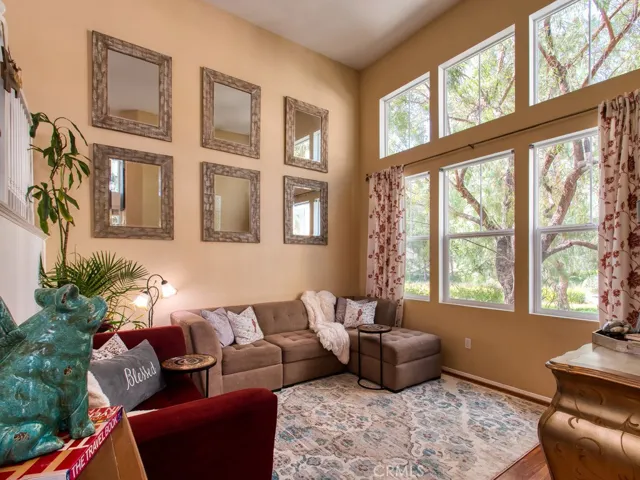 TALL VAULTED CEILINGS-- LIGHT AND BRIGHT with tons of natural light!  Amazing views of the park-like setting-so much privacy being an end unit also!  Plenty of space for entertaining.