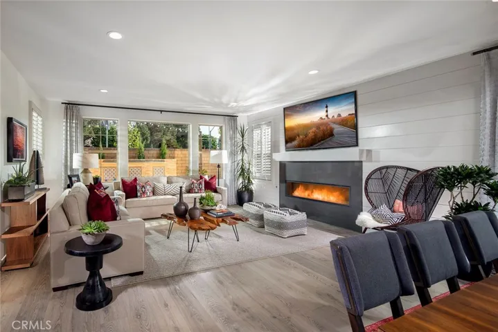 Great room features wood flooring and recessed lighting throughout- as shown in model photo.